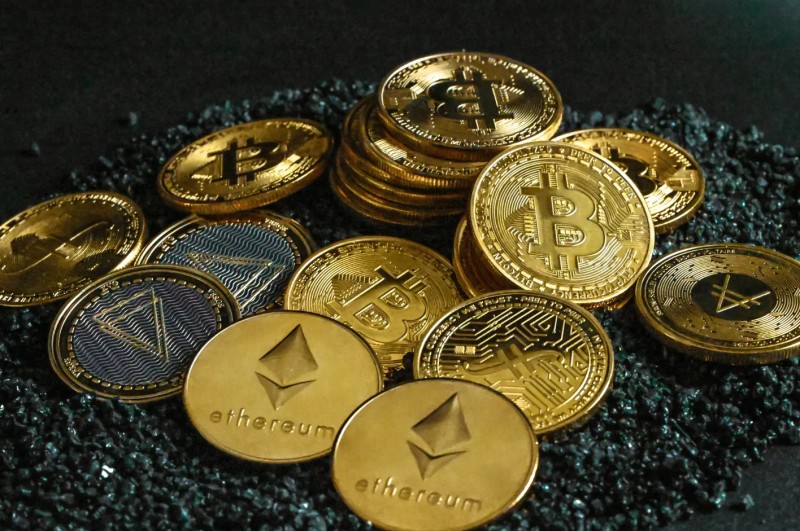 Person holding phone with crypto thought
